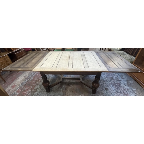 179 - A 1930s oak draw leaf dining table - approx. 78cm high x 100cm wide x 140cm long