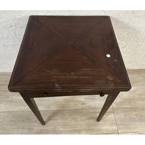 18 - An Edwardian mahogany folding envelope card table - approx. 70cm high x 53cm wide x 53cm deep