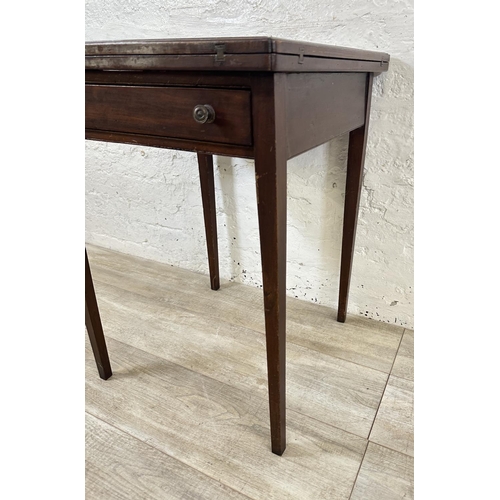 18 - An Edwardian mahogany folding envelope card table - approx. 70cm high x 53cm wide x 53cm deep