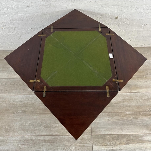 18 - An Edwardian mahogany folding envelope card table - approx. 70cm high x 53cm wide x 53cm deep