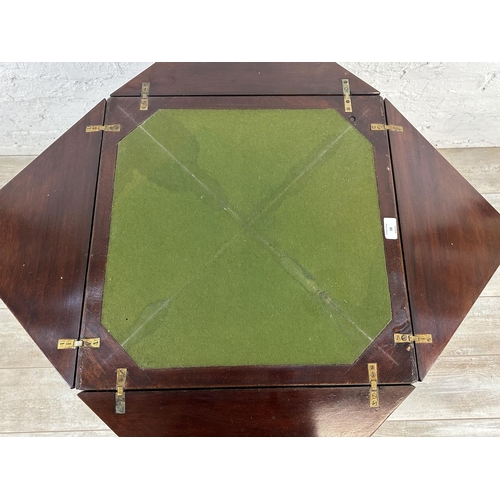 18 - An Edwardian mahogany folding envelope card table - approx. 70cm high x 53cm wide x 53cm deep