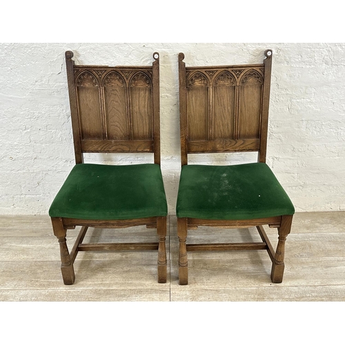 181 - A pair of 17th century style carved oak and green fabric upholstered dining chairs