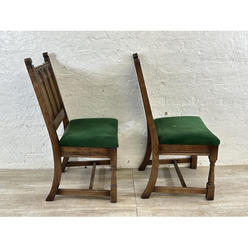 181 - A pair of 17th century style carved oak and green fabric upholstered dining chairs