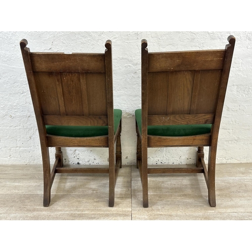 181 - A pair of 17th century style carved oak and green fabric upholstered dining chairs