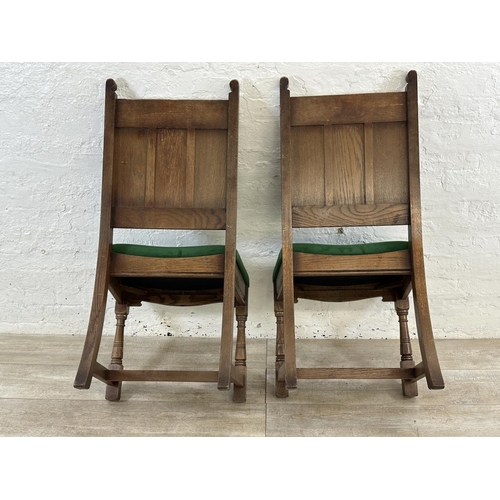 181 - A pair of 17th century style carved oak and green fabric upholstered dining chairs