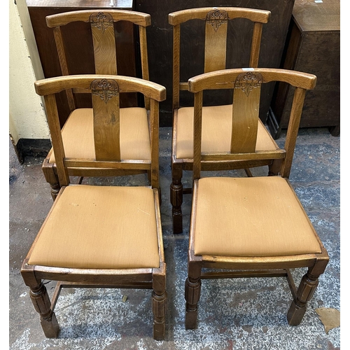 182 - Four 1930s carved oak and brown fabric upholstered dining chairs