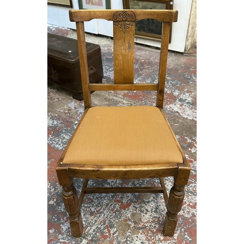 182 - Four 1930s carved oak and brown fabric upholstered dining chairs