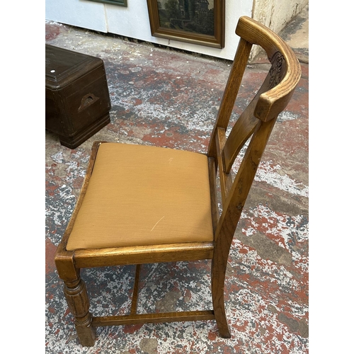 182 - Four 1930s carved oak and brown fabric upholstered dining chairs