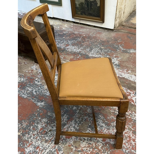 182 - Four 1930s carved oak and brown fabric upholstered dining chairs