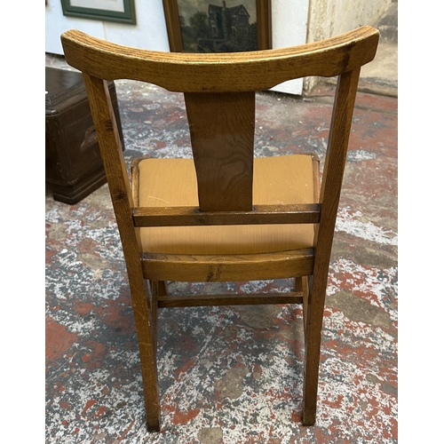 182 - Four 1930s carved oak and brown fabric upholstered dining chairs