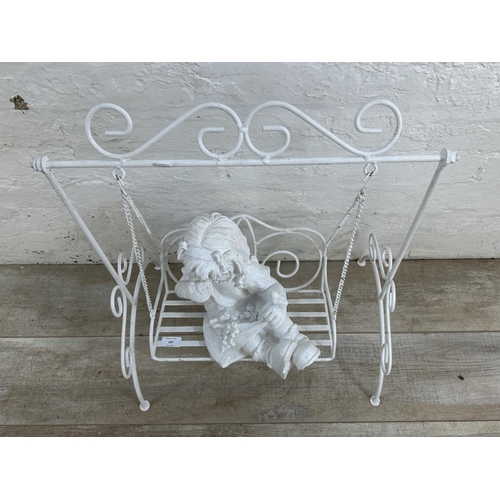 183 - A white painted wrought metal fibreglass child and swing garden ornament - approx. 65cm high x 51cm ... 