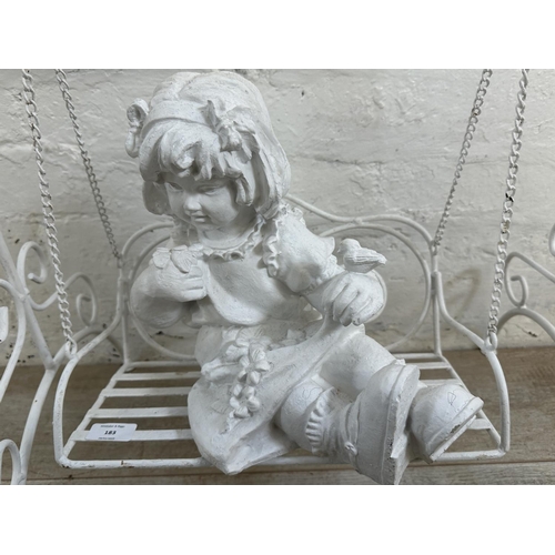 183 - A white painted wrought metal fibreglass child and swing garden ornament - approx. 65cm high x 51cm ... 