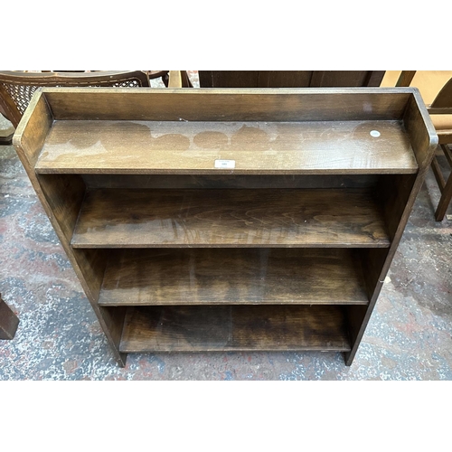 185 - A mid 20th century beech four tier bookcase - approx. 91cm high x 76cm wide x 22cm deep