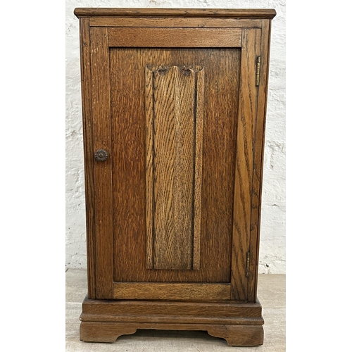 186 - A mid 20th century carved oak linenfold bedside cabinet - approx. 67cm high x 39cm wide x 35cm deep