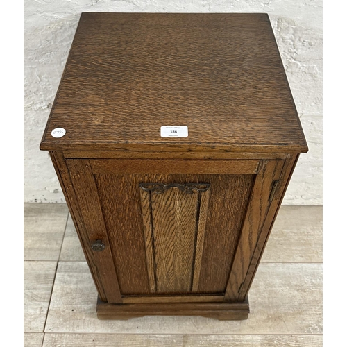 186 - A mid 20th century carved oak linenfold bedside cabinet - approx. 67cm high x 39cm wide x 35cm deep