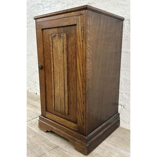 186 - A mid 20th century carved oak linenfold bedside cabinet - approx. 67cm high x 39cm wide x 35cm deep