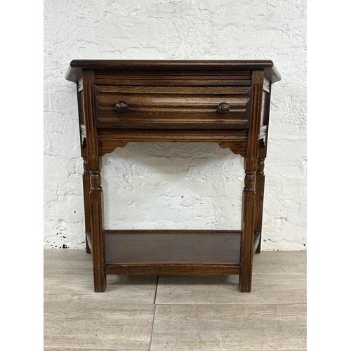 191 - An oak two tier console table - approx. 73cm high x 80cm wide x 37cm deep