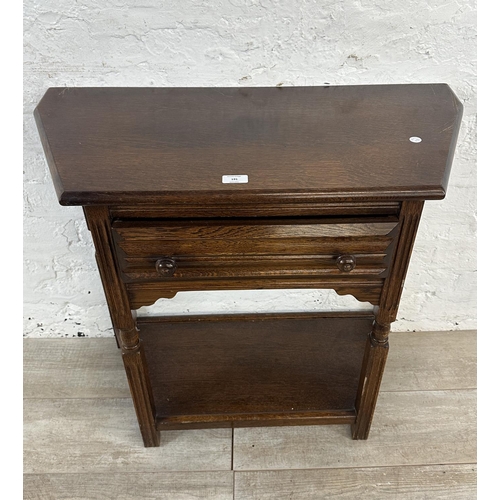 191 - An oak two tier console table - approx. 73cm high x 80cm wide x 37cm deep