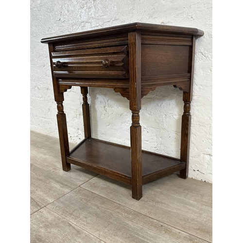 191 - An oak two tier console table - approx. 73cm high x 80cm wide x 37cm deep