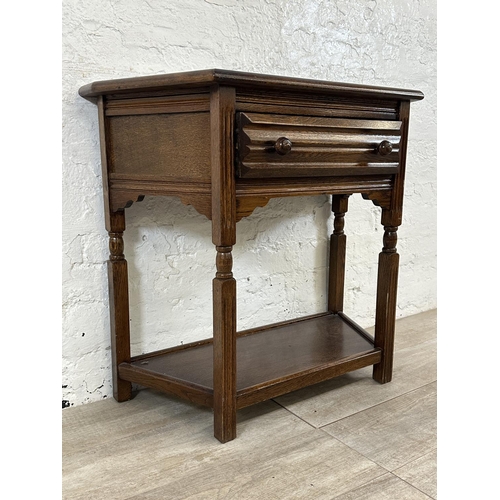 191 - An oak two tier console table - approx. 73cm high x 80cm wide x 37cm deep