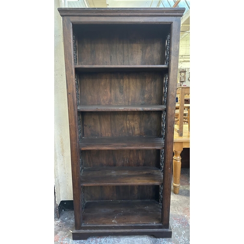 193 - An Indian sheesham wood and wrought metal five tier bookcase - approx. 182cm high x 86cm wide x 37cm... 