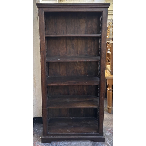 193 - An Indian sheesham wood and wrought metal five tier bookcase - approx. 182cm high x 86cm wide x 37cm... 