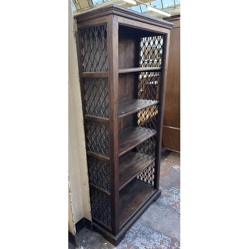 193 - An Indian sheesham wood and wrought metal five tier bookcase - approx. 182cm high x 86cm wide x 37cm... 