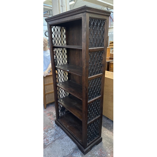 193 - An Indian sheesham wood and wrought metal five tier bookcase - approx. 182cm high x 86cm wide x 37cm... 