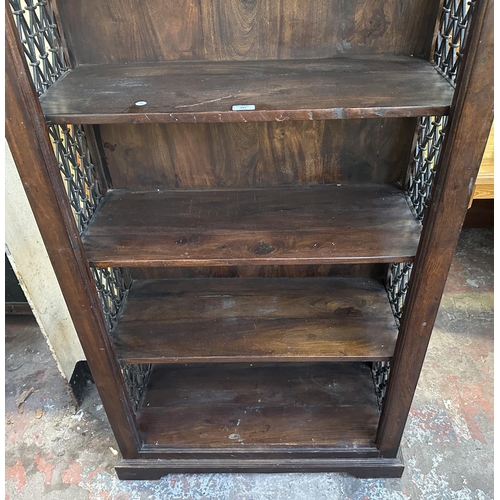 193 - An Indian sheesham wood and wrought metal five tier bookcase - approx. 182cm high x 86cm wide x 37cm... 