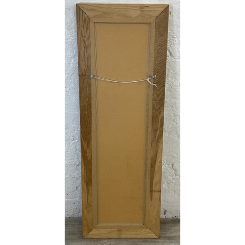 194 - A modern oak framed bevelled edge wall mirror - approx. 140cm high x 48cm wide