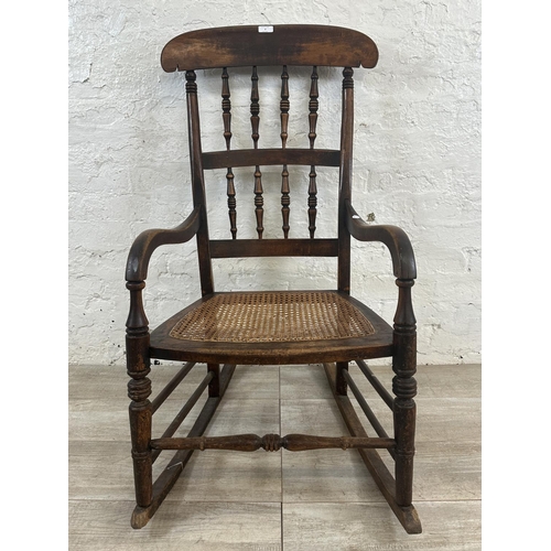 2 - A 19th century beech and cane seated rocking chair - approx. 104cm high x 55cm wide x 72cm deep