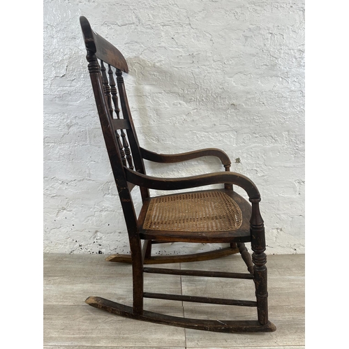 2 - A 19th century beech and cane seated rocking chair - approx. 104cm high x 55cm wide x 72cm deep