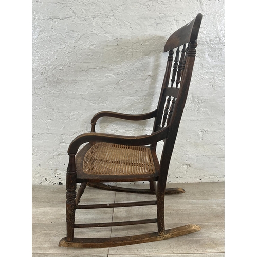 2 - A 19th century beech and cane seated rocking chair - approx. 104cm high x 55cm wide x 72cm deep