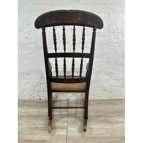 2 - A 19th century beech and cane seated rocking chair - approx. 104cm high x 55cm wide x 72cm deep