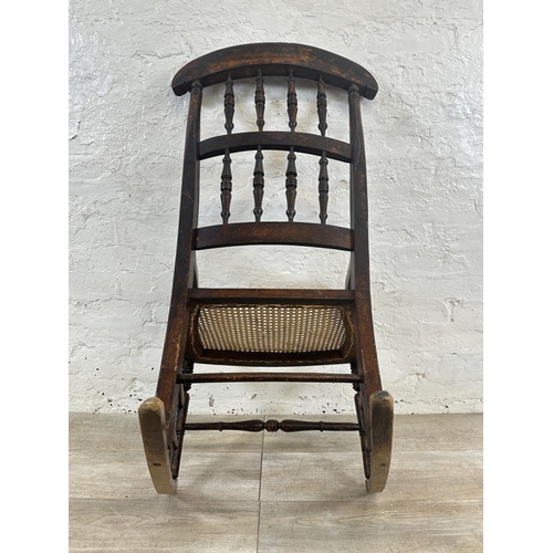 2 - A 19th century beech and cane seated rocking chair - approx. 104cm high x 55cm wide x 72cm deep