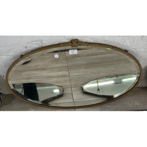 21 - Five mid 20th century bevelled edge wall mirrors, one gilt framed and four frameless - largest appro... 