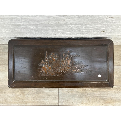 22 - A Chinese carved camphor wood blanket box - approx. 40cm high x 76cm wide x 36cm deep