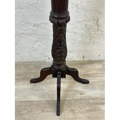 24 - A carved mahogany jardinière stand - approx. 131cm high x 32cm wide x 32cm deep