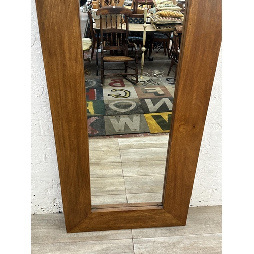 28 - A modern mango wood framed wall mirror - approx. 70cm high x 145cm wide