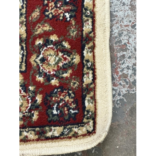 30 - Two Egyptian Carrera 100% polypropylene rugs - approx. 170cm x 120cm