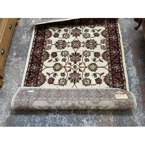 30 - Two Egyptian Carrera 100% polypropylene rugs - approx. 170cm x 120cm