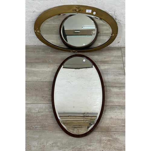 32 - Two framed bevelled edge wall hanging mirrors, one mahogany and one gilt - largest approx. 50cm high... 