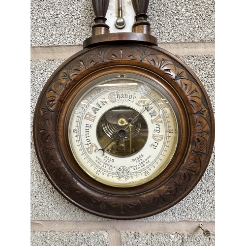 35 - Two late 19th/early 20th century barometers, one German mahogany cased and one oak cased aneroid - l... 