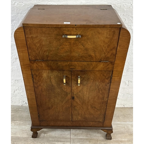 36 - An Art Deco walnut cocktail cabinet - approx. 120cm high x 74cm wide x 38.5cm deep