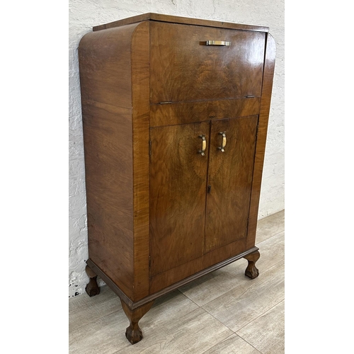 36 - An Art Deco walnut cocktail cabinet - approx. 120cm high x 74cm wide x 38.5cm deep