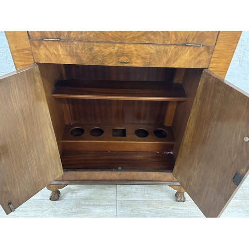 36 - An Art Deco walnut cocktail cabinet - approx. 120cm high x 74cm wide x 38.5cm deep