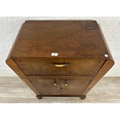 36 - An Art Deco walnut cocktail cabinet - approx. 120cm high x 74cm wide x 38.5cm deep