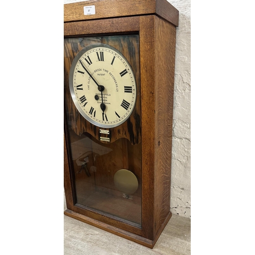 37 - An early 20th century The Gledhill-Brook Time Recorders Ltd oak cased time recorder converted wall c... 