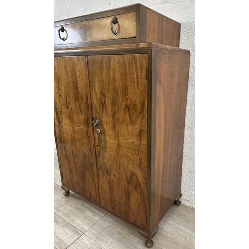 38 - An Art Deco walnut double door tallboy/gentlemen's wardrobe - approx. 128cm high x 84cm wide x 44cm ... 