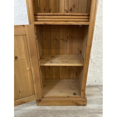 39 - A pine free standing bookcase - approx. 119cm high x 58cm wide x 37cm deep